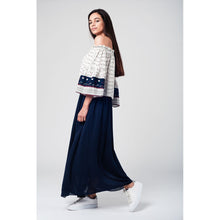 White navy off shoulders top with belled sleeves and floral print