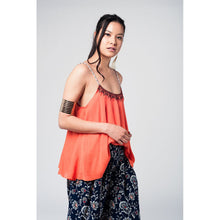 Orange top with aztec black and red embroidery