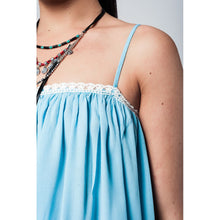 Blue top with white crochet detailing