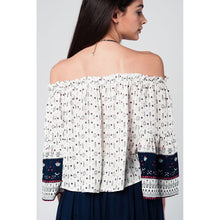 White navy off shoulders top with belled sleeves and floral print