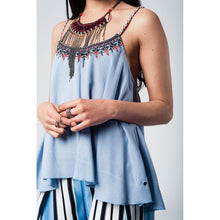 Blue top with aztec black and red embroidery