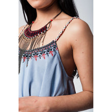 Blue top with aztec black and red embroidery