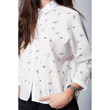 White blouse printed with black butterflies and dots