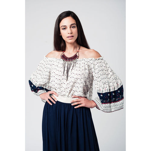 White navy off shoulders top with belled sleeves and floral print