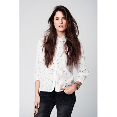 White blouse printed with black butterflies and dots