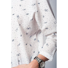 White blouse printed with black butterflies and dots